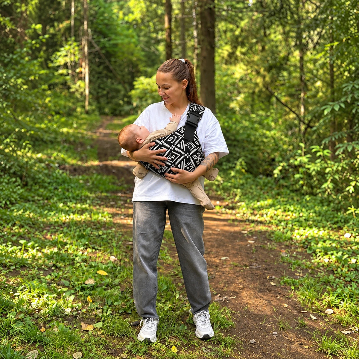 #Bonsai Black | Mum carrying baby on a forest walk